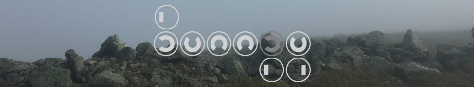 The Bumpy Records logo over a foggy, rocky hilltop
